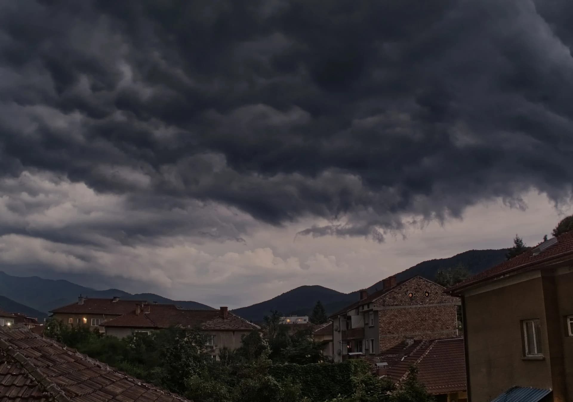 Dark storm clouds building over a residential neighborhood